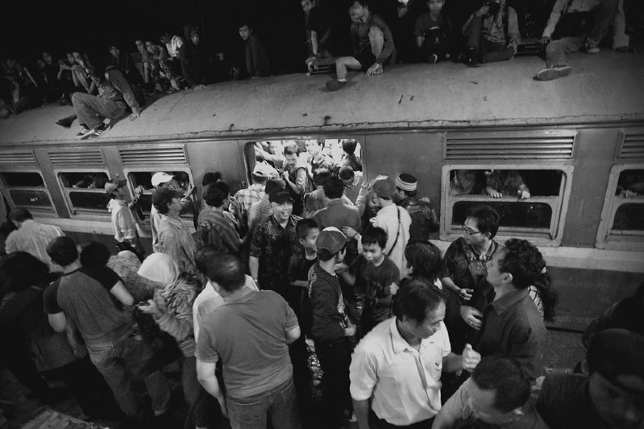 Image of economy class rail passengers, Jakarta, by Aan Kasman from https://flic.kr/p/92xxPB (https://creativecommons.org/licenses/by/2.0/)